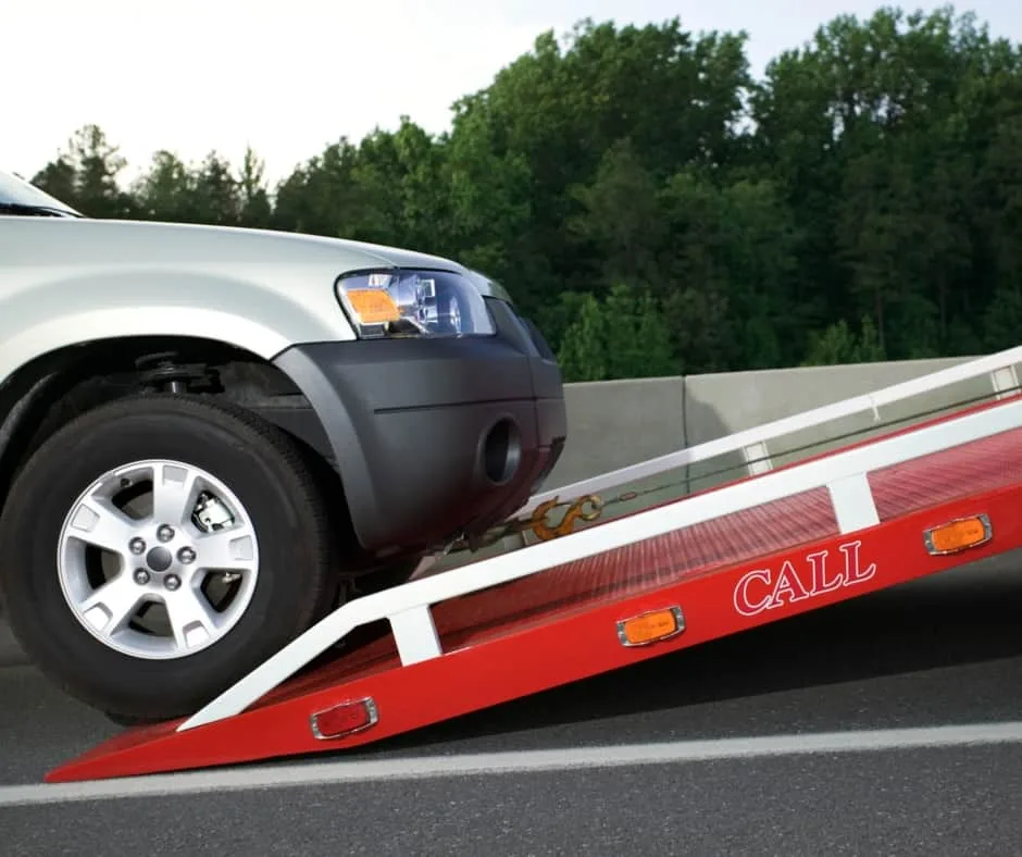 Richmond tow truck loading a vehicle on a residential street