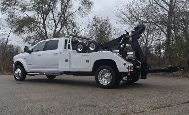 Richmond wrecker equipment securing damaged vehicle